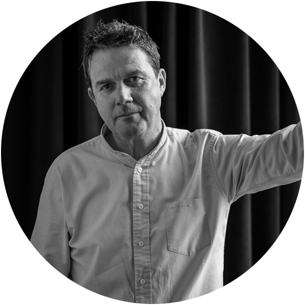 Portrait of Jonathan Tuckey in black and white