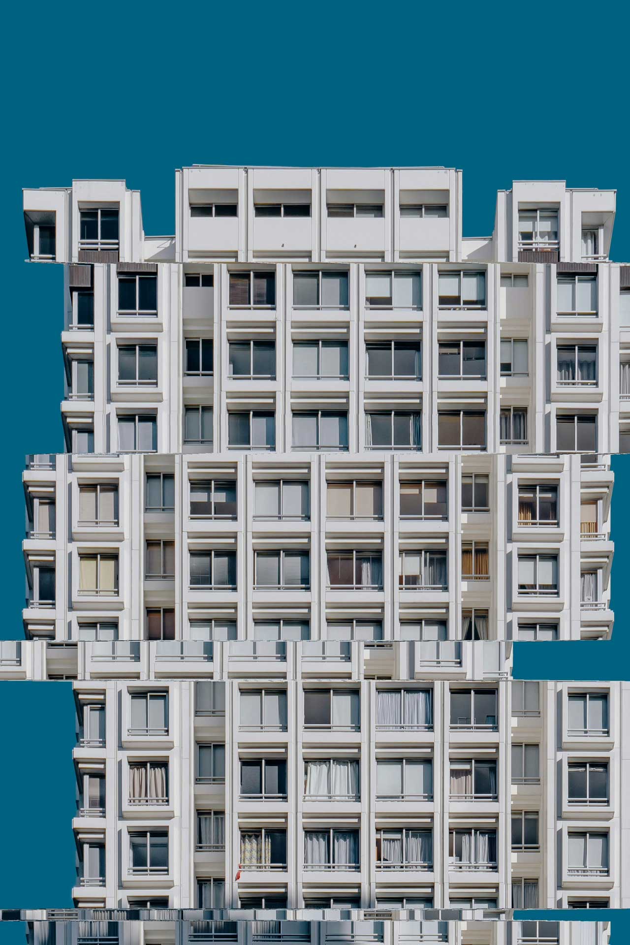 Bright facade of a residential building that is looking like a cube.