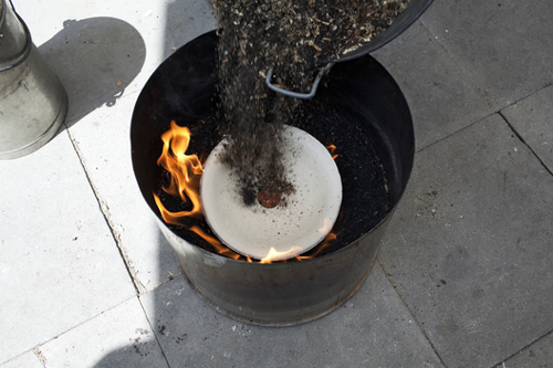 02-sawdust fire working the fire