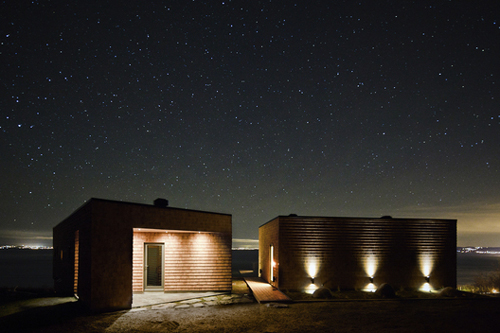 12-night rear elevation Noght shot of the entrance